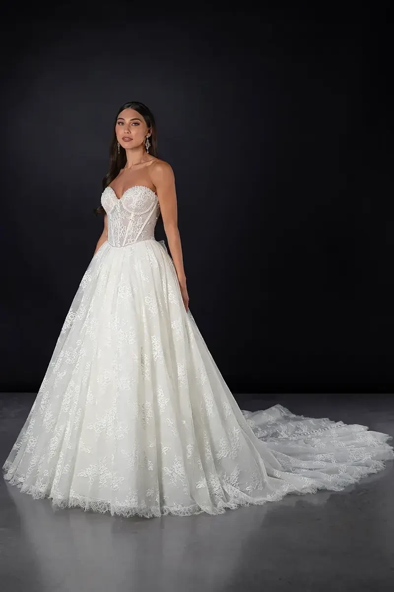 model is wearing a strapless basque waist wedding gown