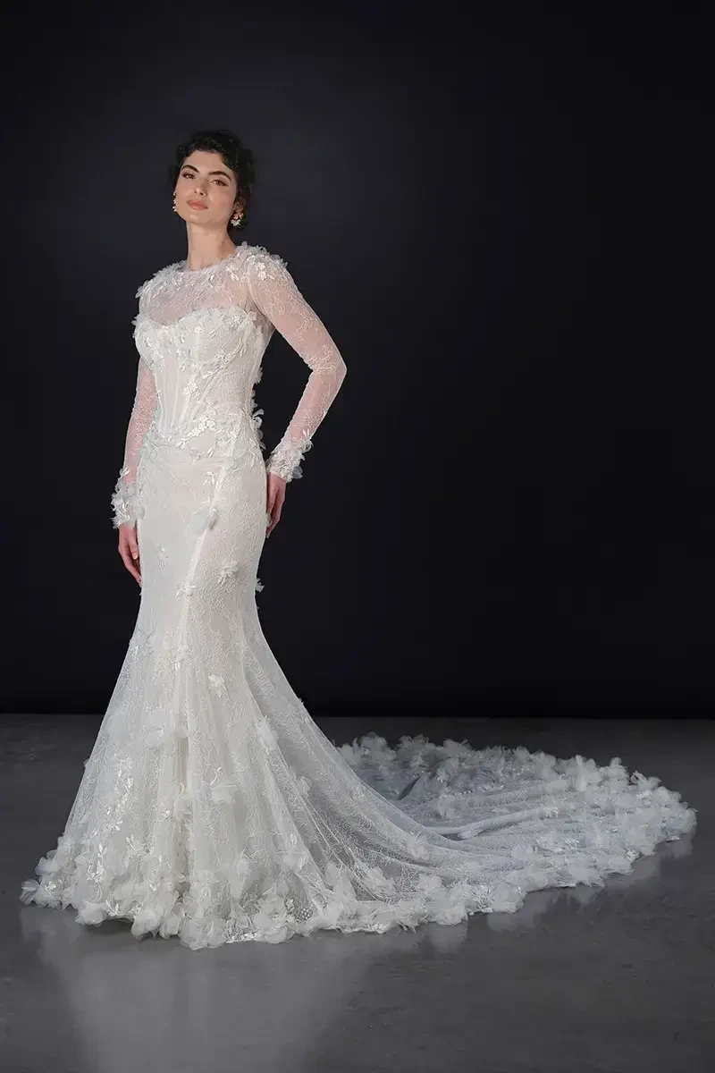 model is wearing an allover lace fit and flare bridal gown