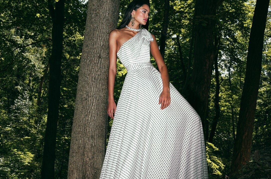 Model wearing a bridal Collection Gown by Brides by the Falls
