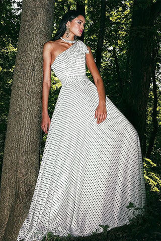 Model wearing a bridal Collection Gown by Brides by the Falls